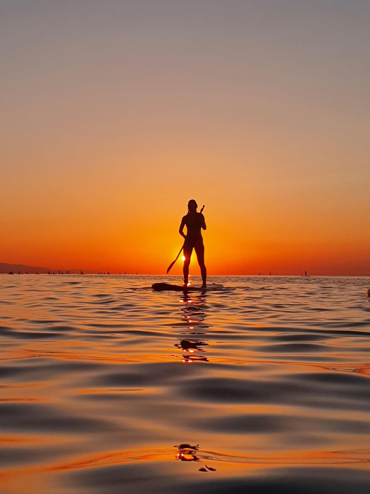 Paddle surf al amanecer en Barcelona