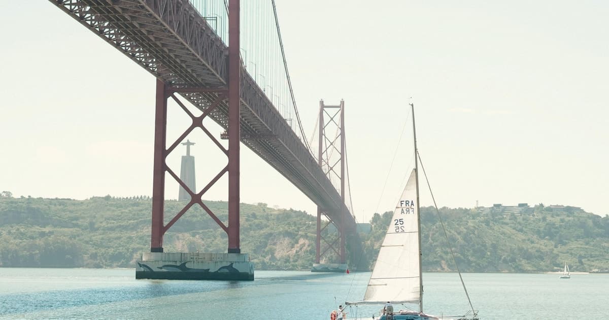 Explore Lisbon on a sailing boat on the Tagus River at sunrise or sunset