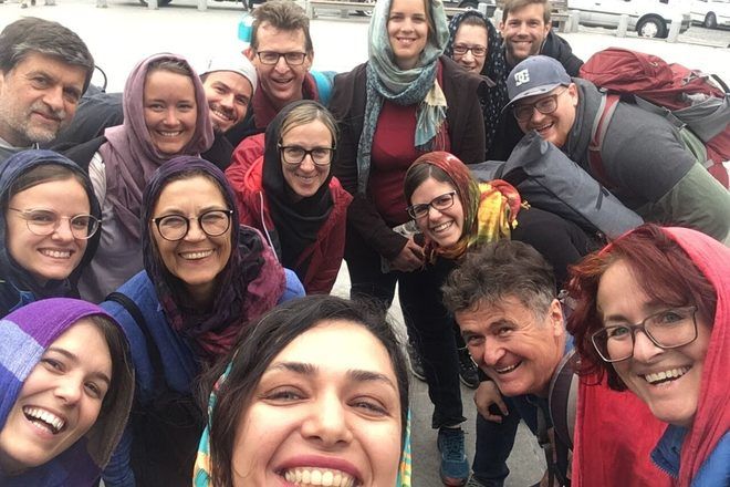 Selfie of a group of travelers taken during a free walking tour in Tehran, Iran.