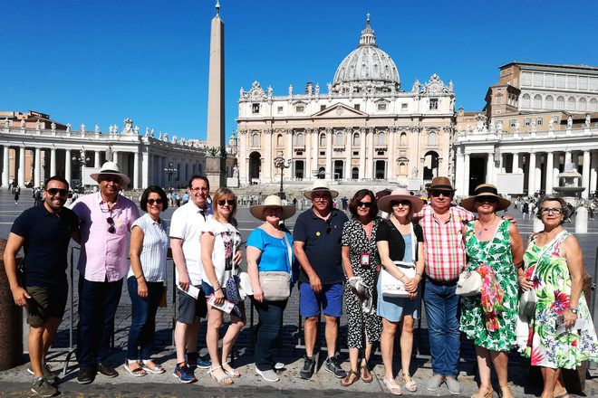 Group of travelers on a free walking tour in the Vatican City. 